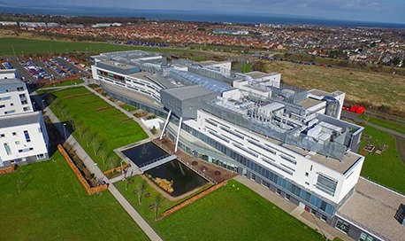 An aerial view of Ӱֱ Campus with Edinburgh sprawling out beyond it