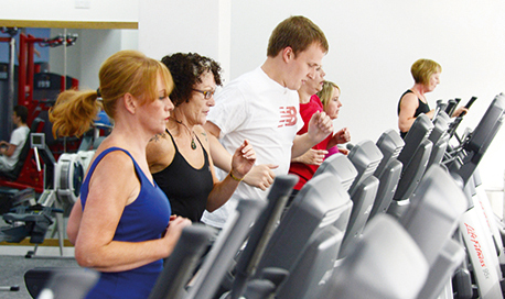 A line of treadmills in use in the Ӱֱ Sports Centre